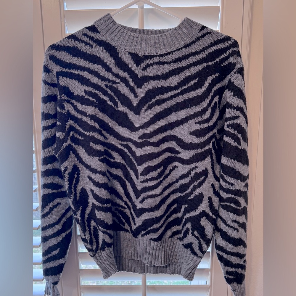 Never worn! Brand new! Zebra print sweater! Very soft!